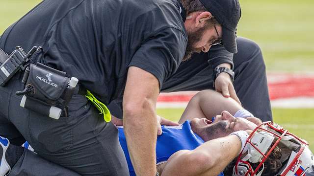 SMU quarterback on the ground after suffering a lower leg injury against Navy.